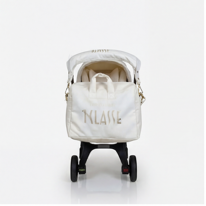 Front centered view of beige world map cover set on Doona + with matching diaper bag.