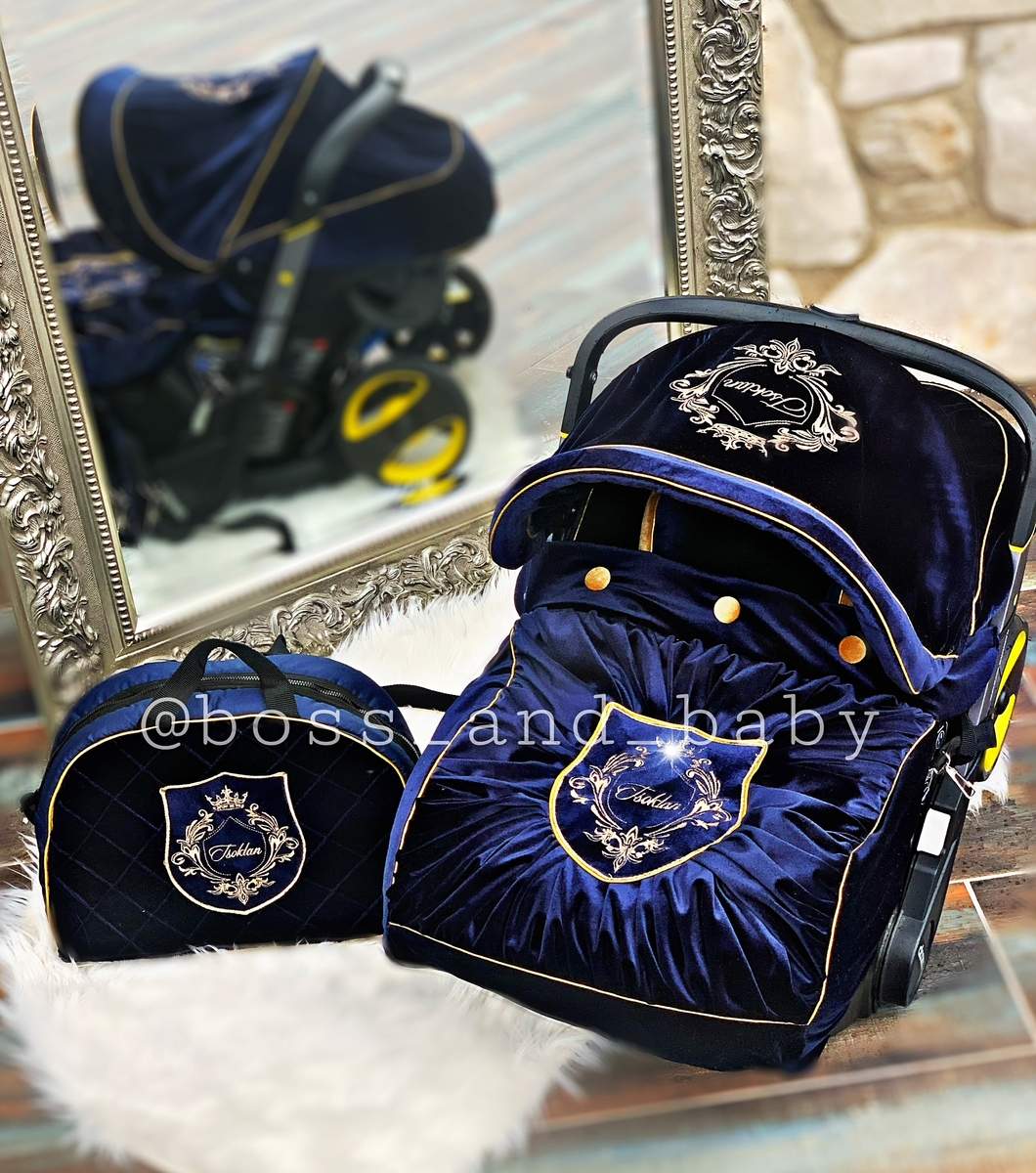 Baby boy car seat cover with diaper bag and blanket