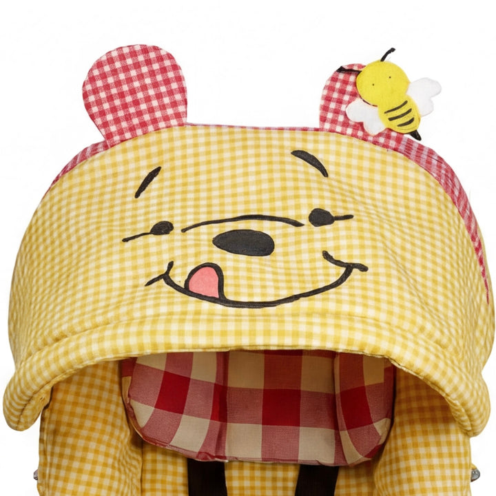 Yellow gingham Doona+ car seat canopy with bear face embroidery and bee detail, front view.