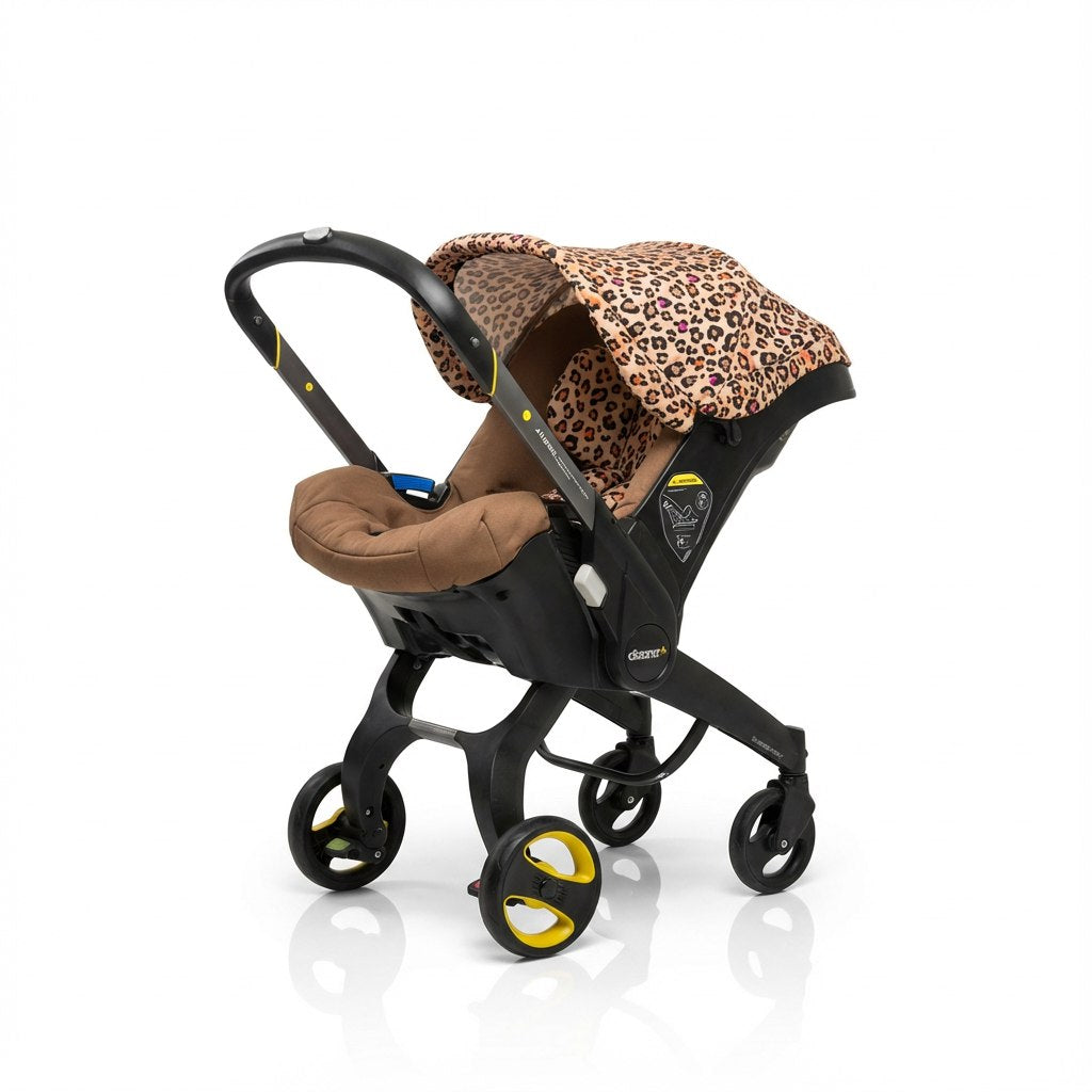 Baby car seat cover on a Doona car seat with a leopard print canopy and brown padded seat insert, photographed on a white background.