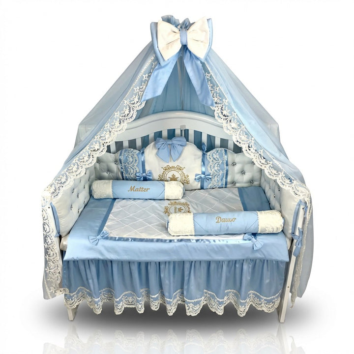 Baby blue crib with blue and white bedding set and canopy on a white background