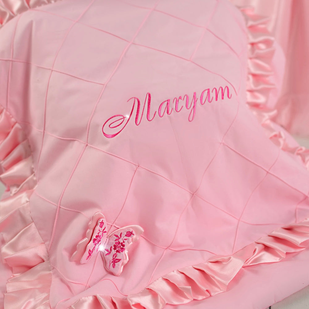 Pink baby blanket with ruffles and embroidered name 'Maryam'