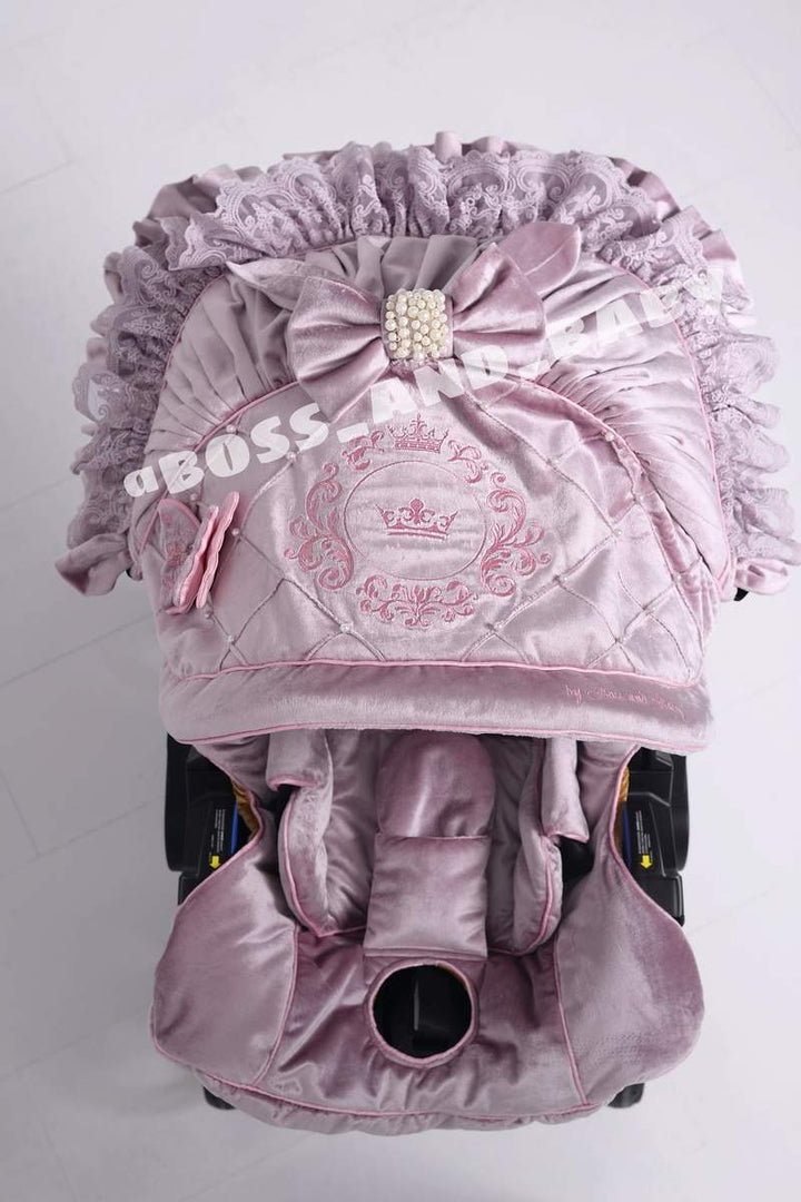 Customizable little girl's Doona stroller car seat with soft, stylish covers & accessories - Perfect for infant comfort, protection, and essential baby gear