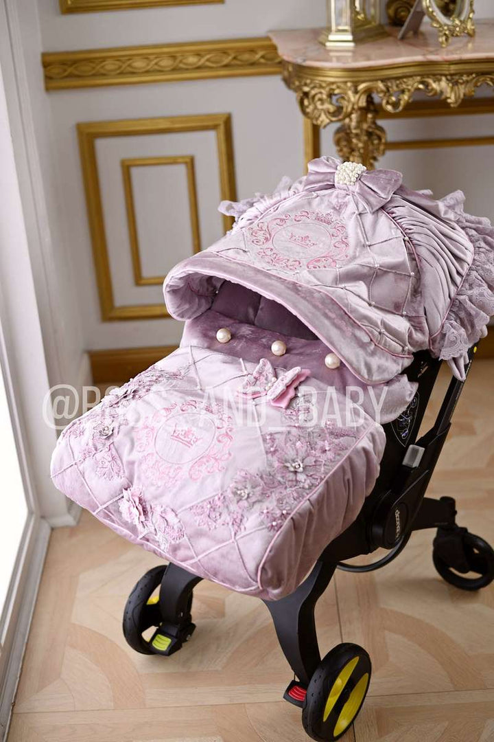 Customizable little girl's Doona stroller car seat with soft, stylish covers & accessories - Perfect for infant comfort, protection, and essential baby gear