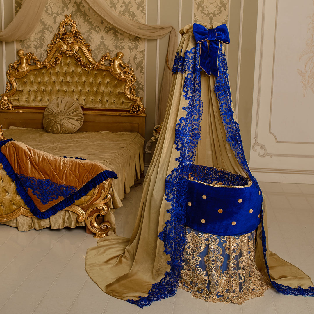 Luxury royal blue and gold velvet nursery decor set with decorative baby cradle, lace canopy, and premium handcrafted details.