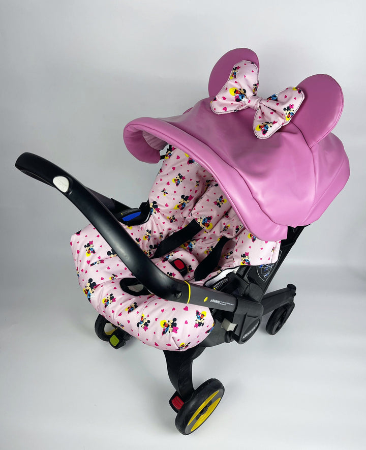 Housse de siège auto rose Minnie Mouse Doona pour bébé fille